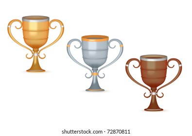 Gold, silver and bronze trophies isolated on white