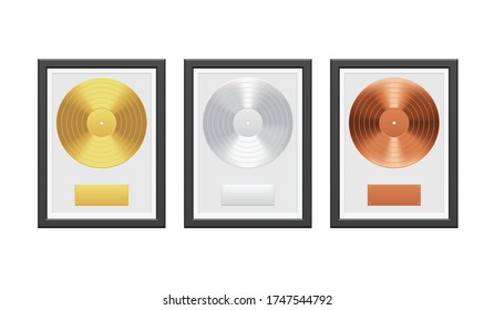 Gold, Silver And Bronze Vinyl Record With Black Frame On White Brick Wall