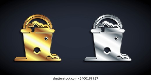 Gold and silver Bucket with foam and bubbles icon isolated on black background. Cleaning service concept. Long shadow style. Vector