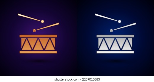 Gold and silver Drum with drum sticks icon isolated on black background. Music sign. Musical instrument symbol.  Vector