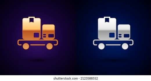 Gold and silver Hand truck and boxes icon isolated on black background. Dolly symbol.  Vector