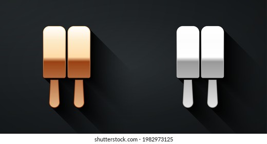 Gold and silver Ice cream on stick icon isolated on black background. Sweet symbol. Long shadow style. Vector