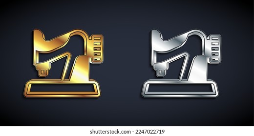 Gold and silver Sewing machine icon isolated on black background. Long shadow style. Vector