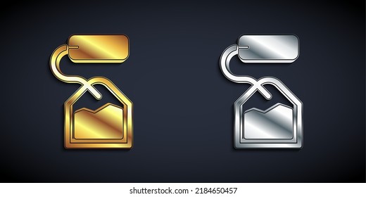 Gold and silver Tea bag icon isolated on black background. Long shadow style. Vector