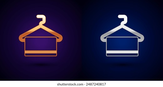 Gold and silver Towel on hanger icon isolated on black background. Bathroom towel icon.  Vector