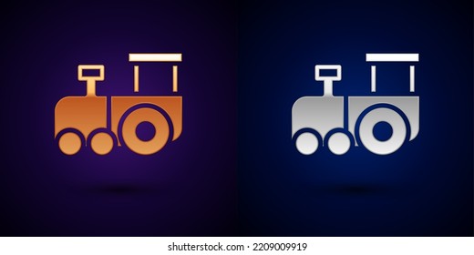 Gold and silver Toy train icon isolated on black background.  Vector