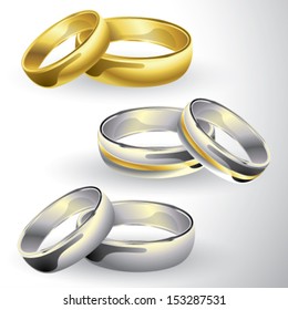 Gold and silver wedding rings in pair