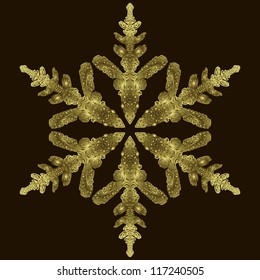 Gold snowflake on a dark background