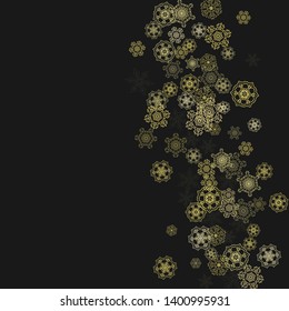 Gold snowflakes frame on black background. New year theme. Stylish shiny Christmas frame for holiday banner, card, sales, special offers. Falling snow with gold snowflakes and glitter for party invite