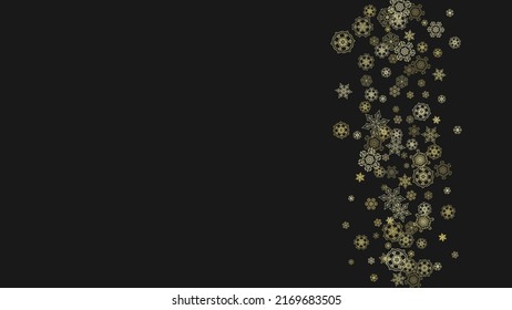 Gold snowflakes frame on black background. New year theme. Horizontal shiny Christmas frame for holiday banner, card, sale, special offer. Falling snow with gold snowflake and glitter for party invite