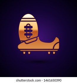Gold Soccer or football shoes with spikes icon isolated on dark blue background. American football boot and ball.  Vector Illustration