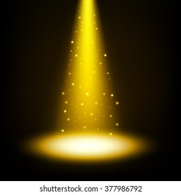 Gold spotlight shining with sprinkles