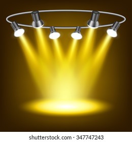 Gold spotlights in dark background