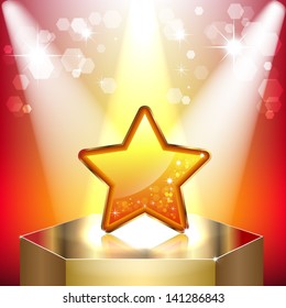 Gold star on a pedestal. Symbol of success and victory. The scene illuminated by floodlights