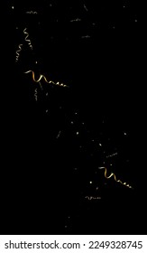 Gold Streamer Flying Vector Black Background. Abstract Star Template. Serpentine Anniversary Poster. Yellow Decoration Plant.