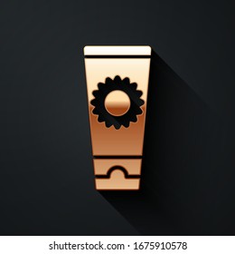 Gold Sunscreen cream in tube icon isolated on black background. Protection for the skin from solar ultraviolet light. Long shadow style. Vector Illustration