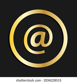 gold at symbol on the dark background.