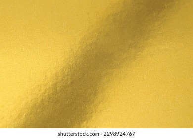Gold texture background in bright light. Shiny luxury gold color texture background.