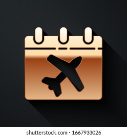 Gold Travel planning calendar and airplane icon isolated on black background. A planned holiday trip. Long shadow style. Vector Illustration