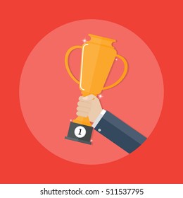 gold trophy for winner. hands holding gold winners cup.Business success,business concept ,
