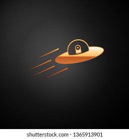 Gold UFO flying spaceship and alien icon isolated on black background. Flying saucer. Alien space ship. Futuristic unknown flying object. Vector Illustration