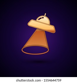 Gold UFO flying spaceship icon isolated on dark blue background. Flying saucer. Alien space ship. Futuristic unknown flying object.  Vector Illustration