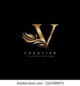 gold V letter logo design with luxurious and beautiful leaf ornament. V Monogram. V typography. gold feather logo. initial letter V logo. suitable for business logo, hotel, boutique, wedding, etc
