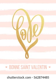 Gold Valentine love heart French calligraphy text on golden pattern background for luxury black greeting card.
