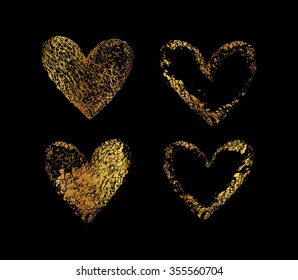 Gold vector hearts. Golden set of the hand drawing hearts, isolated on black.