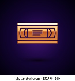 Gold VHS video cassette tape icon isolated on dark blue background.  Vector Illustration