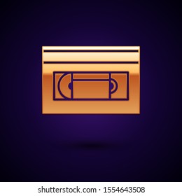 Gold VHS video cassette tape icon isolated on dark blue background.  Vector Illustration