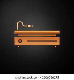 Gold Video game console icon isolated on black background.  Vector Illustration