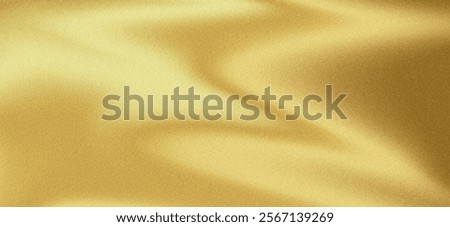Gold wall texture background with shiny yellow foil effect. Glossy light reflections create a vibrant, luxurious feel, perfect for elegant golden paper or premium wallpaper designs. High quality image