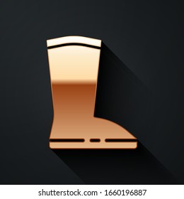 Gold Waterproof rubber boot icon isolated on black background. Gumboots for rainy weather, fishing, gardening. Long shadow style. Vector Illustration