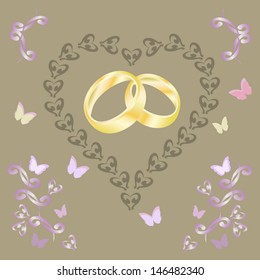 gold wedding ring and a butterfly