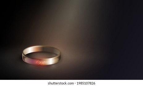 Gold wedding ring engraved with the word "love"