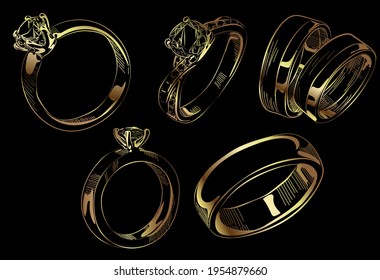 Gold wedding rings on a black background. Engagement diamond rings.