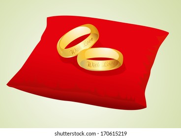 Gold Wedding Rings On Red Satin Pillow