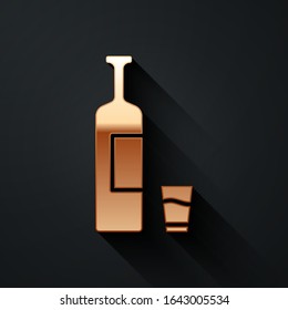 Gold Whiskey bottle and glass icon isolated on black background. Long shadow style. Vector Illustration