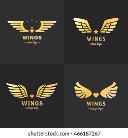 Gold wings logo vector set on the black background. Vintage hipster design. Part four.
