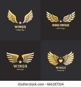 Gold wings logo vector set on the black background. Vintage hipster design. Part one.