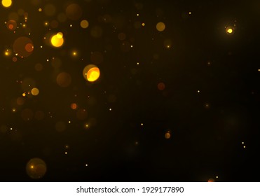 Oro, efecto bokeh amarillo sobre el fondo negro. Partículas mágicas esparcen.
