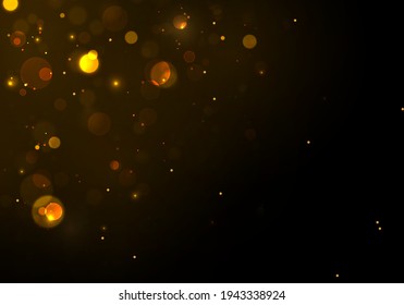 Gold, yellow bokeh effect on black background. Sparkling magical particles.