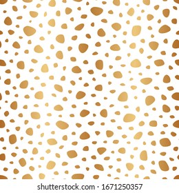 Golden background polka dot. Seamless pattern. Random gold dots, circles, animal skin. Design for fabric, wallpaper, prints. Irregular random abstract texture with dots. Repeating graphic backdrop