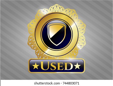  Golden badge with armor icon and Used text inside