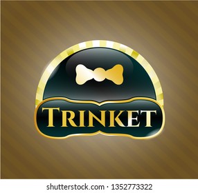  Golden badge with bow tie icon and Trinket text inside