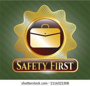  Golden badge with business briefcase icon and Safety First text inside