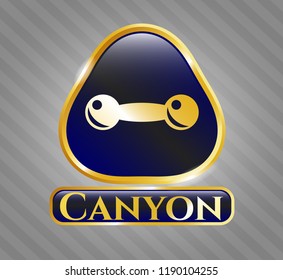  Golden badge with dumbbell icon and Canyon text inside