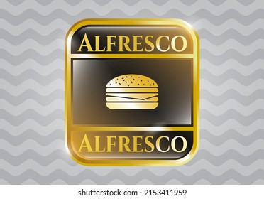 Golden badge or emblem with cheeseburger icon and Alfresco text inside