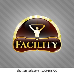   Golden badge with lat pull down, exercise icon and Facility text inside